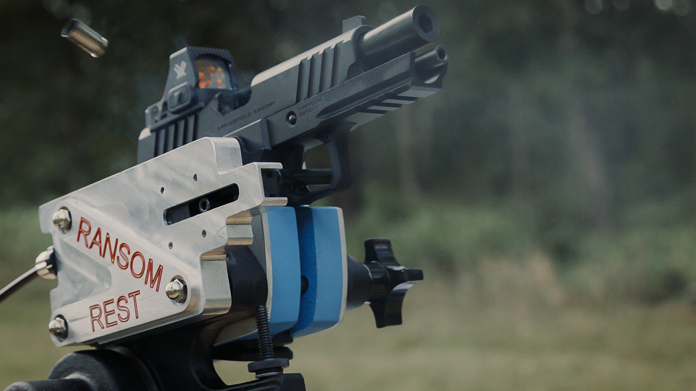 The Springfield Prodigy Compact recoils during firing while secured in a Ransom mechanical rest. The Springfield Armory Prodigy Compact review documented accuracy through controlled testing. This bench rest method captures the pistol mid-cycle. The compact 1911 DS handles 9mm recoil effectively. Mechanical testing removes shooter influence from results. The Prodigy Compact's bull barrel enhances accuracy potential. Springfield engineered this handgun for consistent performance. The recoil impulse appears manageable in testing. This double-stack compact delivers precise shot placement.