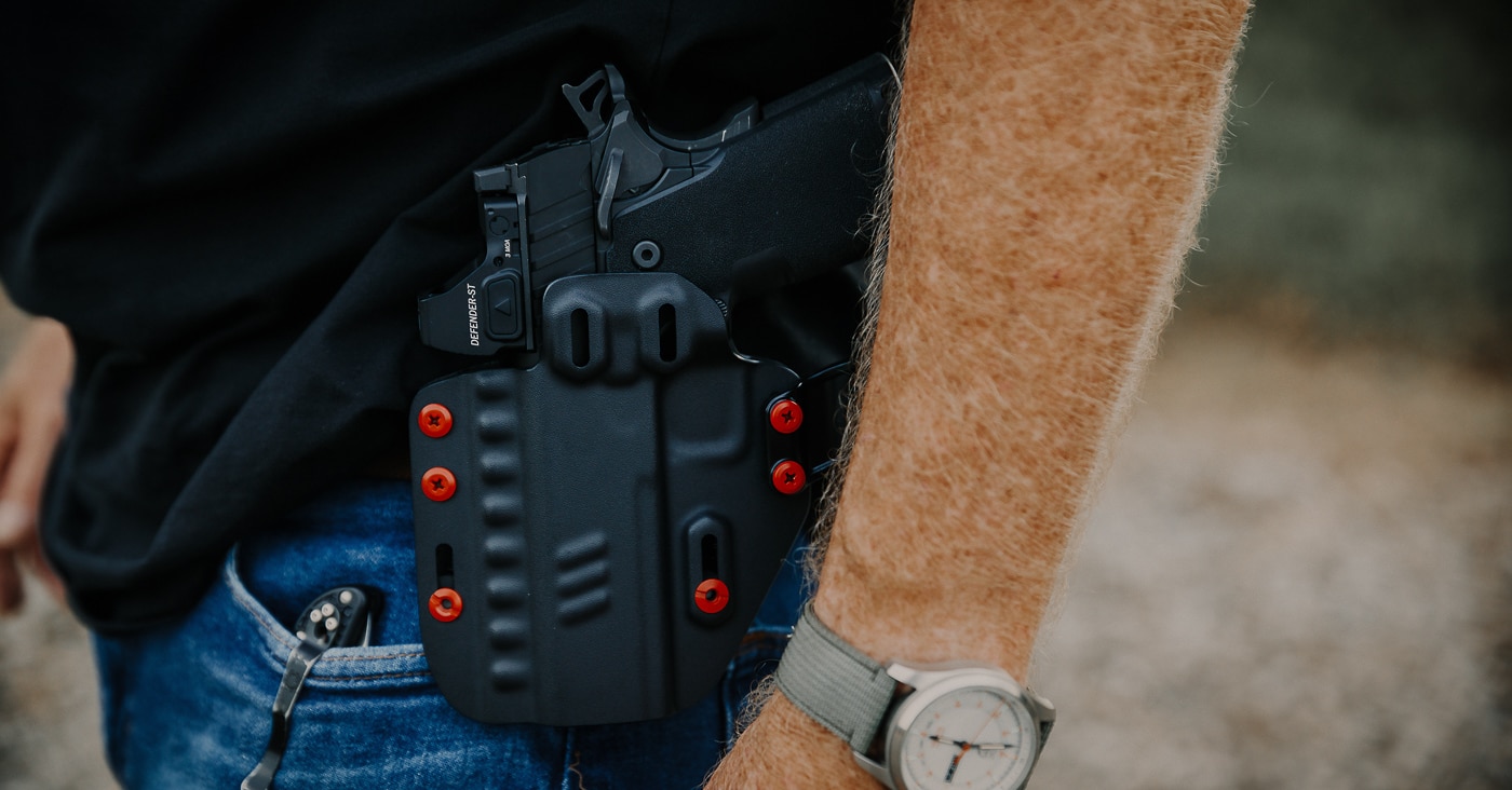 The Springfield Prodigy Compact pistol sits secured in a Crossbreed Rogue holster configured for outside-the-waistband carry. The Springfield Armory Prodigy Compact review tested everyday carry performance. This kydex holster provides excellent firearm retention. The compact 1911 DS conceals well in this setup. Springfield recommends the Rogue holster for this pistol. The OWB configuration allows quick draw access. This carry system keeps the handgun secure. The Prodigy Compact works well as an EDC firearm. The holster and pistol combination performed reliably.