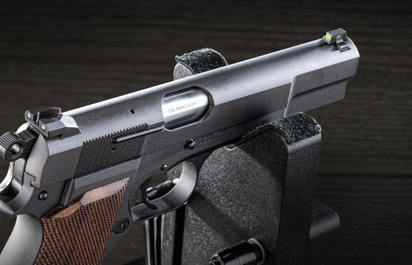 XS Sights R3D 2.0 tritium night sights mounted on a Springfield Armory SA-35 9mm pistol, showing the complete sight installation with the green illuminated front post and serrated rear sight against the pistol's matte-blued finish. Tritium sights for Springfield SA-35 provide reliable illumination. Night sights for SA-35 enhance defensive capabilities. 9mm pistols require quality aiming systems. Self-defense handguns benefit from tritium technology. XS Sights manufactures premium sight products. SA-35 pistols accept dovetail sight installations. Modern sight upgrades improve shooting performance. Quality tritium vials ensure long-lasting glow.