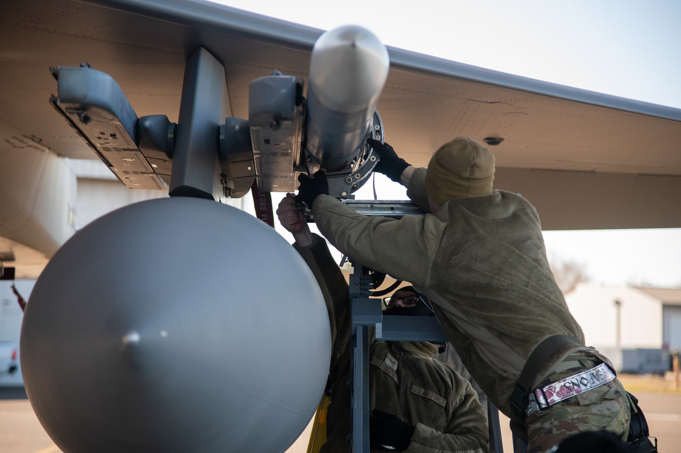Ground crews from Kadena Air Base receive F-15EX weapons loading training at Portland Air National Guard Base during 2025, preparing for the 36 Eagle II fighters scheduled to arrive at the Pacific installation. Airmen practice arming the modernized fighter. Portland's Oregon Air National Guard provides instruction. Kadena prepares infrastructure for Eagle II operations. Weapons handlers learn deep magazine loading procedures. The training covers precision-guided munitions installation. Ground crews study the fighter's weapons stations. Pacific deployment requires fully trained maintenance teams. Cross-base training accelerates operational readiness.