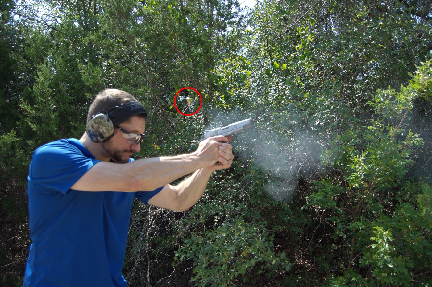 A shooter at an outdoor range conducting accuracy testing with a Springfield Garrison 1911 from a supported bench rest position with sandbags and shooting equipment visible. M1911 pistols require thorough accuracy evaluation as woods guns. Springfield Armory Garrison demonstrates M1911 precision potential. Match-grade barrels deliver tight groupings. Range testing validates defensive firearm choices. Woods guns need verified accuracy standards. The .45 ACP chambering produces consistent results. Chronograph data confirms velocity performance. Scientific testing builds shooter confidence.