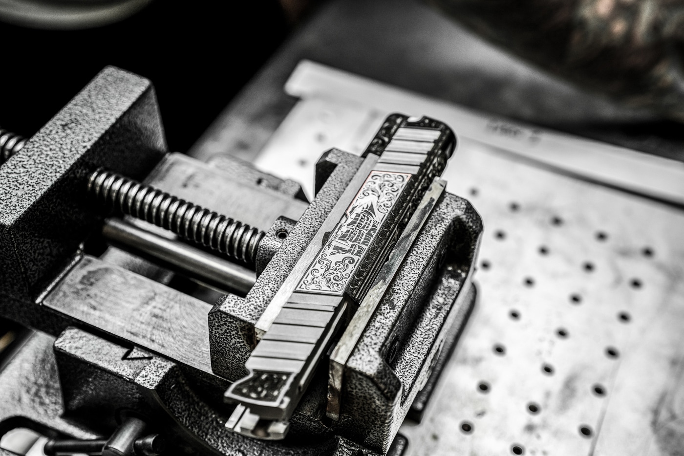 A customized Springfield Prodigy pistol displays pirate-themed nautical imagery including maritime symbols, ships, and ocean elements engraved and finished professionally. The Koted interview features pirate theme build details. Koted Custom Finishings creates cohesive narrative designs. Interview of Koted discusses Isaac Fourged Group collaboration. Traditional pirate aesthetics inspire custom firearms. Koted interview reveals statement piece creation process. Fully wrapped two-tone plating finishes surfaces. The interview of Koted covers Easter egg reward discovery. Koted balances bold styling with handcrafted quality.