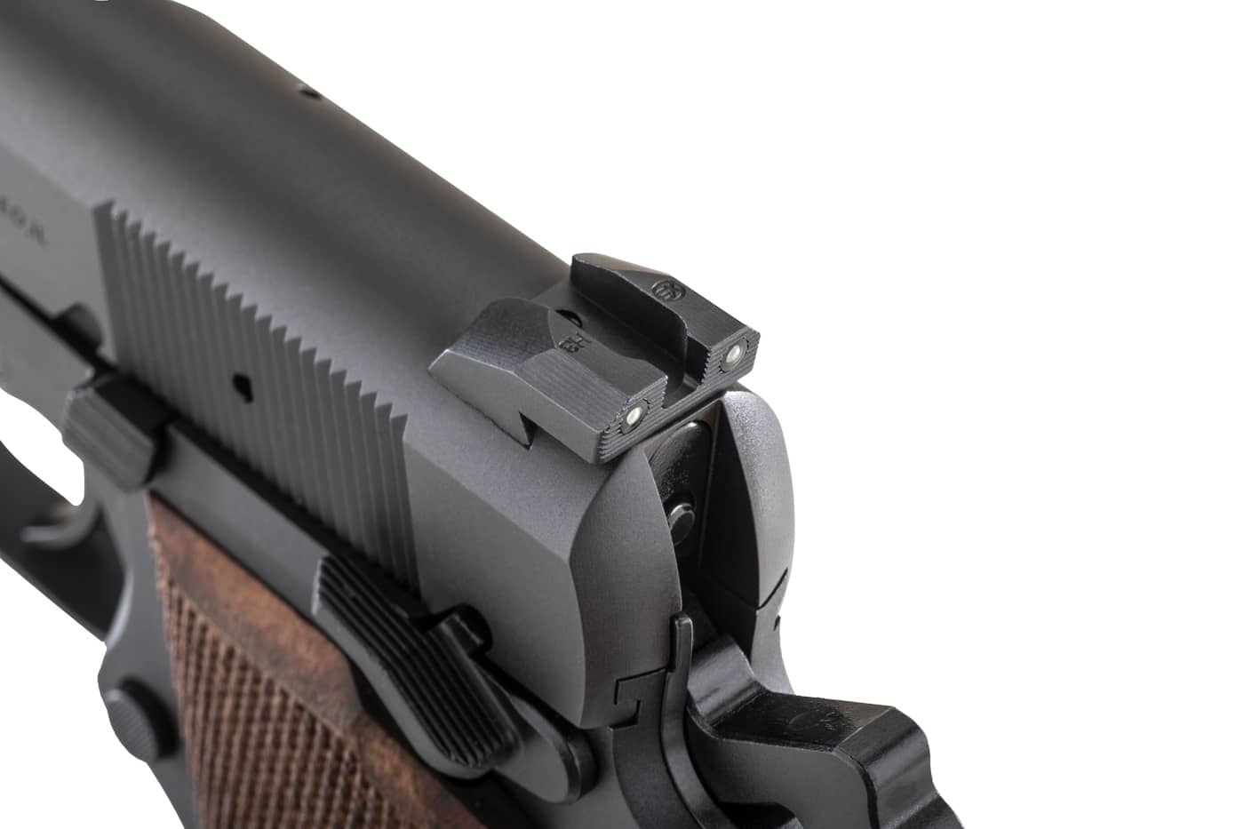 A close-up view of the XS Sights rear night sight installed on the Springfield SA-35, showing the dual tritium vials flanking a wide notch with a serrated rear face and black nitride finish mounted in the rear dovetail of the slide. Night sights for SA-35 feature improved rear visibility. Tritium sights for Springfield SA-35 include dual-vial rear design. Rear sights provide alignment reference points. SA-35 pistols accept upgraded sight components. Serrated surfaces reduce light reflection. Wide notch design speeds sight acquisition. Black nitride finish resists corrosion effectively. Quality rear sights support defensive shooting.