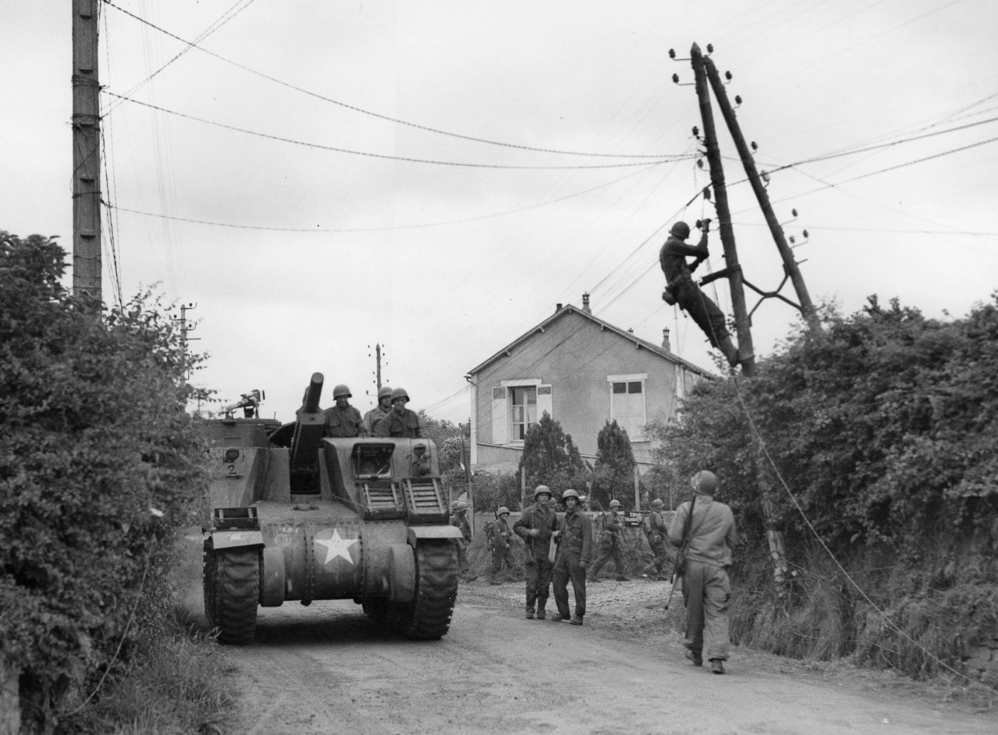 American M7 Priest moves through France in 1944
