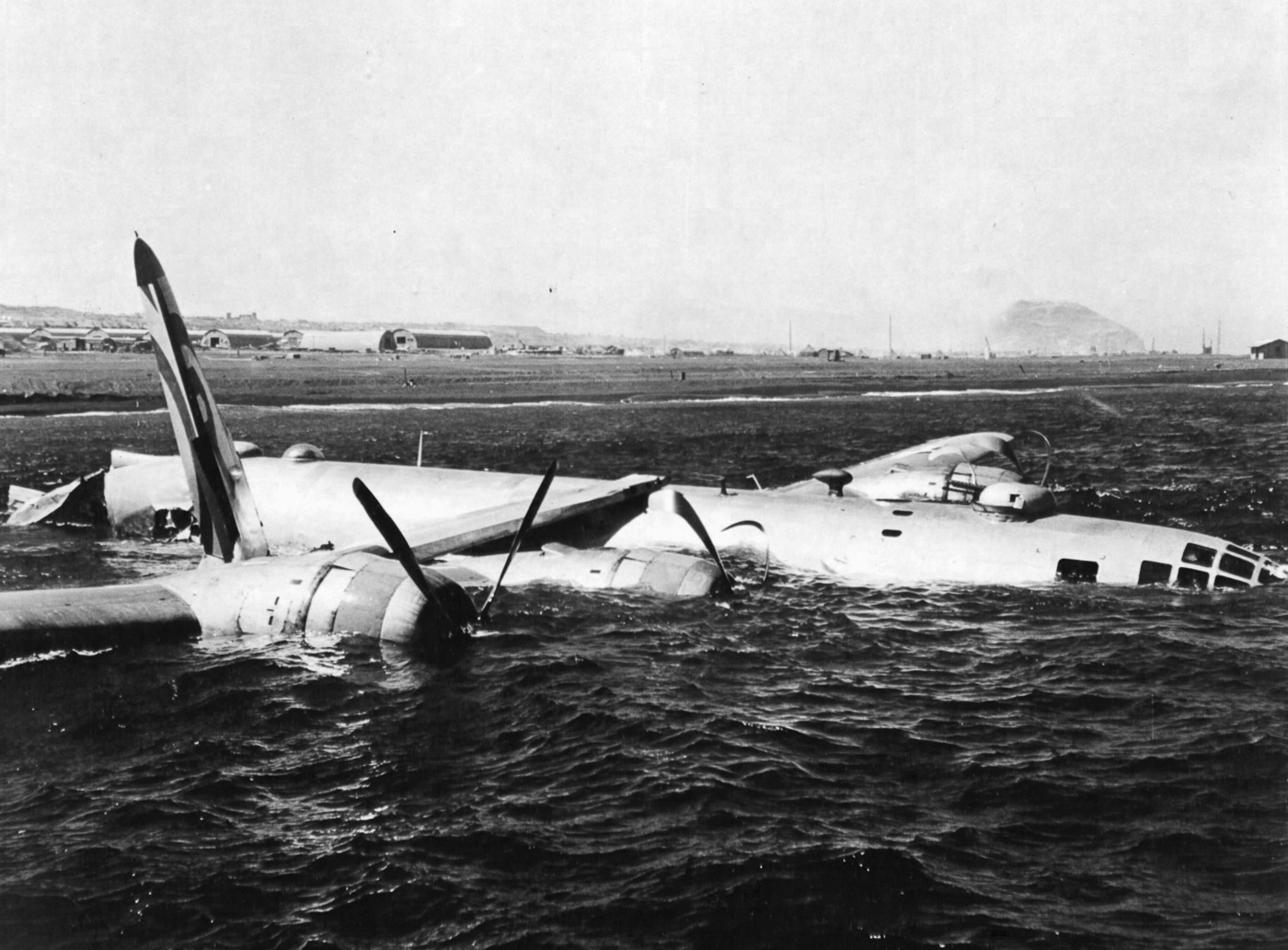 Iwo Jima provided a haven for wounded B-29s struggling to return to their base in the Marianas. The Iwo airstrip was not quite large enough for Superfortress operations, and sometimes the damaged B-29s opted to belly land just offshore. NARA