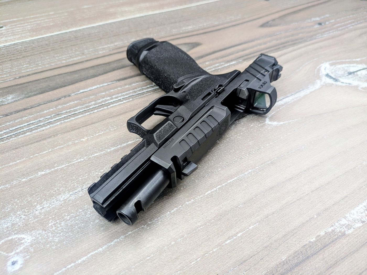 The compensator ports are machined right into the barrel and slide — this isn't just a threaded-on accessory.