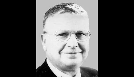 A portrait photograph of Eugene Morrison Stoner, the brilliant self-taught firearms designer who created the revolutionary AR-10 and AR-15 rifle platforms in the 1950s. Eugene Stoner designed iconic rifles. The AR-10 established new standards. Stoner worked for ArmaLite. AR10 history began with Stoner. The designer served as Marine. Stoner understood automatic weapons. Aviation principles influenced his designs. The AR platform defined generations.