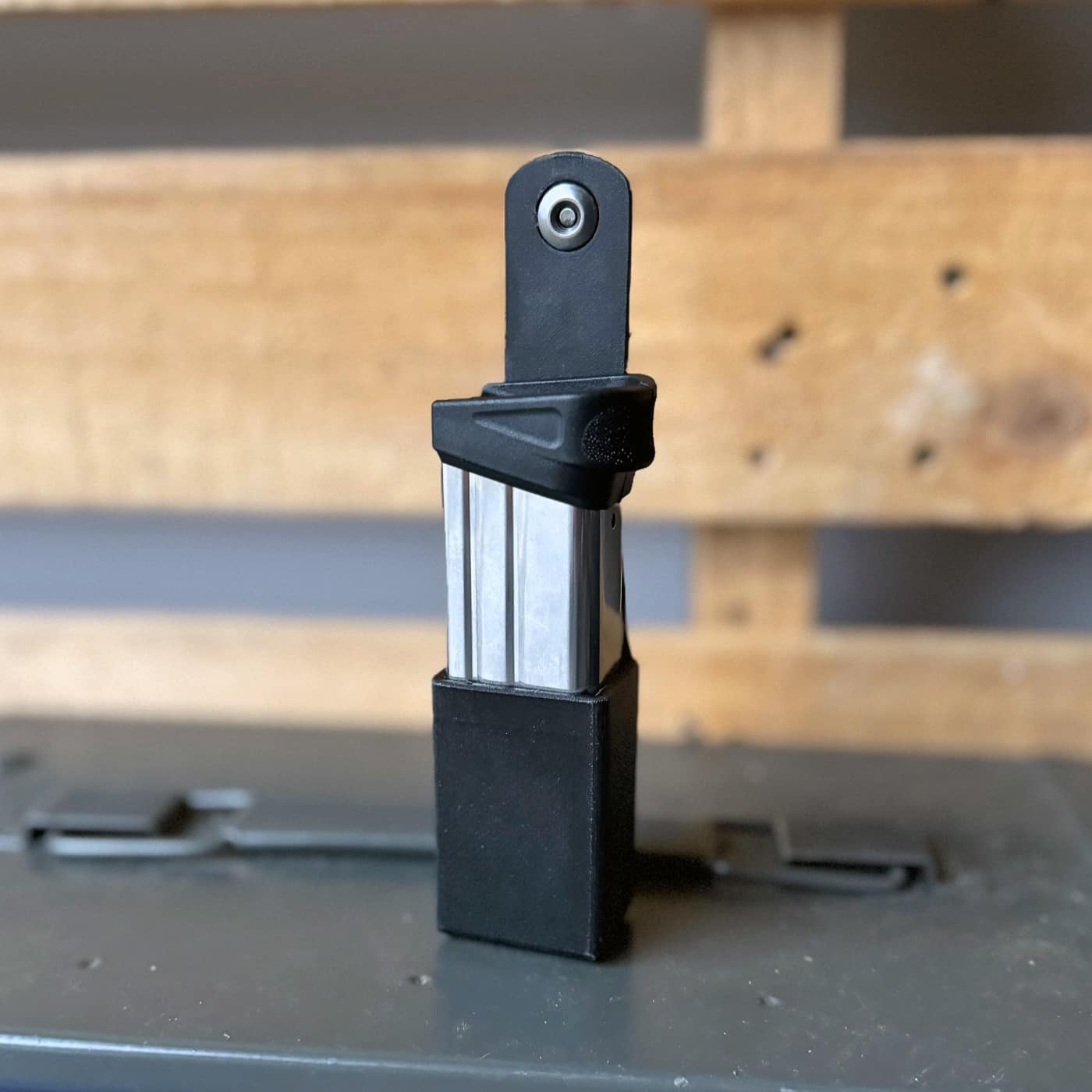 Two Springfield Hellcat magazines — an 11-round and 13-round capacity — are displayed next to the ExtraCarry pouch, demonstrating compatibility with both sizes. ExtraCarry reviews highlight magazine versatility. Hellcat carriers accommodate multiple capacities. Magazine pouch evaluations confirm proper fitment.