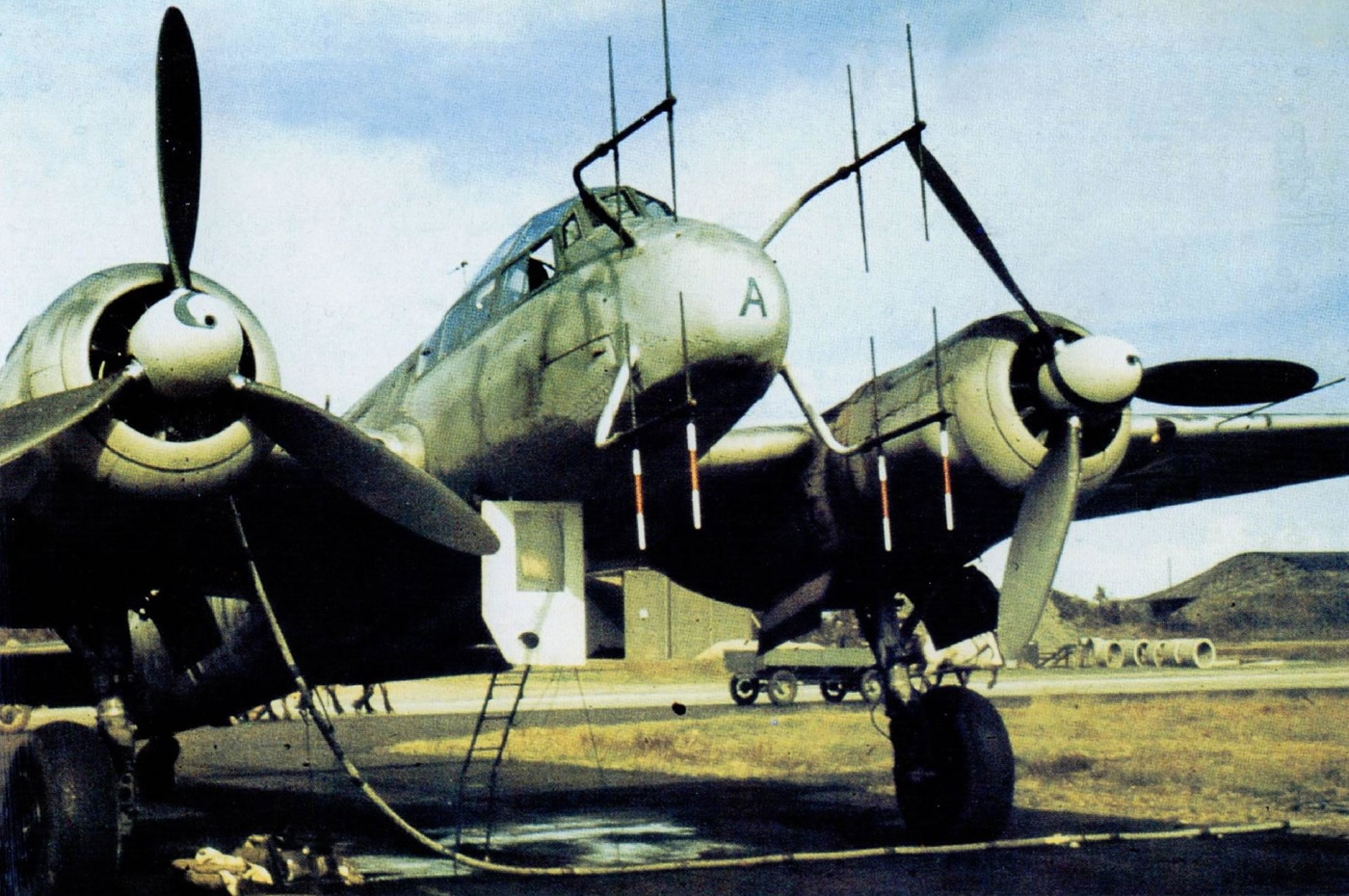 A Junkers Ju 88 G-1 night fighter from 4./Nachtjagdgeschwader 3 stationed at Kjevik airfield near Kristiansand, Norway in 1944. The Ju 88 bomber served in Arctic theater operations. Night fighter variants defended Norwegian territories. NJG 3 squadrons operated from Scandinavian bases. G-1 models featured improved radar systems. Kjevik airfield hosted defensive fighter units. Norwegian deployments protected strategic shipping routes. 1944 marked intensive Allied bombing campaigns. Historical documentation preserves unit assignments.