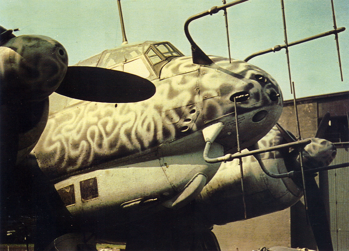 A Junkers Ju 88C night fighter displaying prominent FuG 218 Neptun radar antenna arrays mounted on the aircraft's nose section. The Ju 88 bomber incorporated advanced electronic systems. Night fighter variants utilized radar detection equipment. FuG 218 Neptun enabled target acquisition. German technology countered Allied bombing tactics. Radar installations characterized late-war interceptors. Electronic warfare evolved throughout the conflict. Aircraft modifications improved interception success. Historical examples show technological progression.