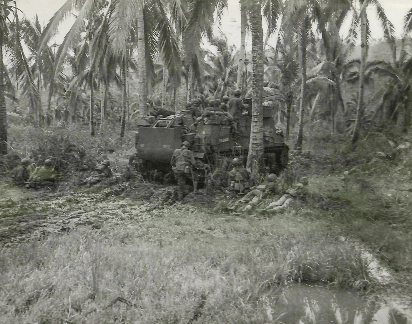 M7 Priest engages Japanese pillbox supporting troops Leyte Island Philippines