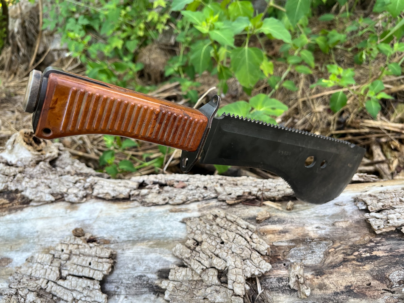 The Russian Taiga is a beast of a tool that combines machete power with precision control in a compact package. It handles the heavy hacking and clearing work without requiring the swing radius or bulk of a full-sized machete.