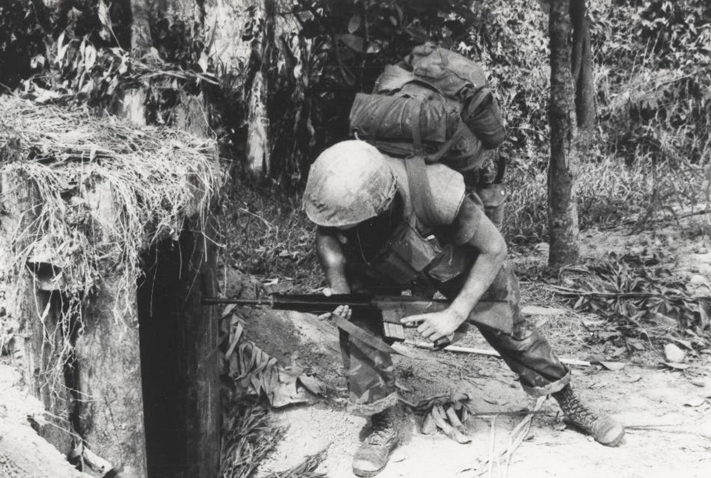 US Marine checks an enemy bunker with his M16A1