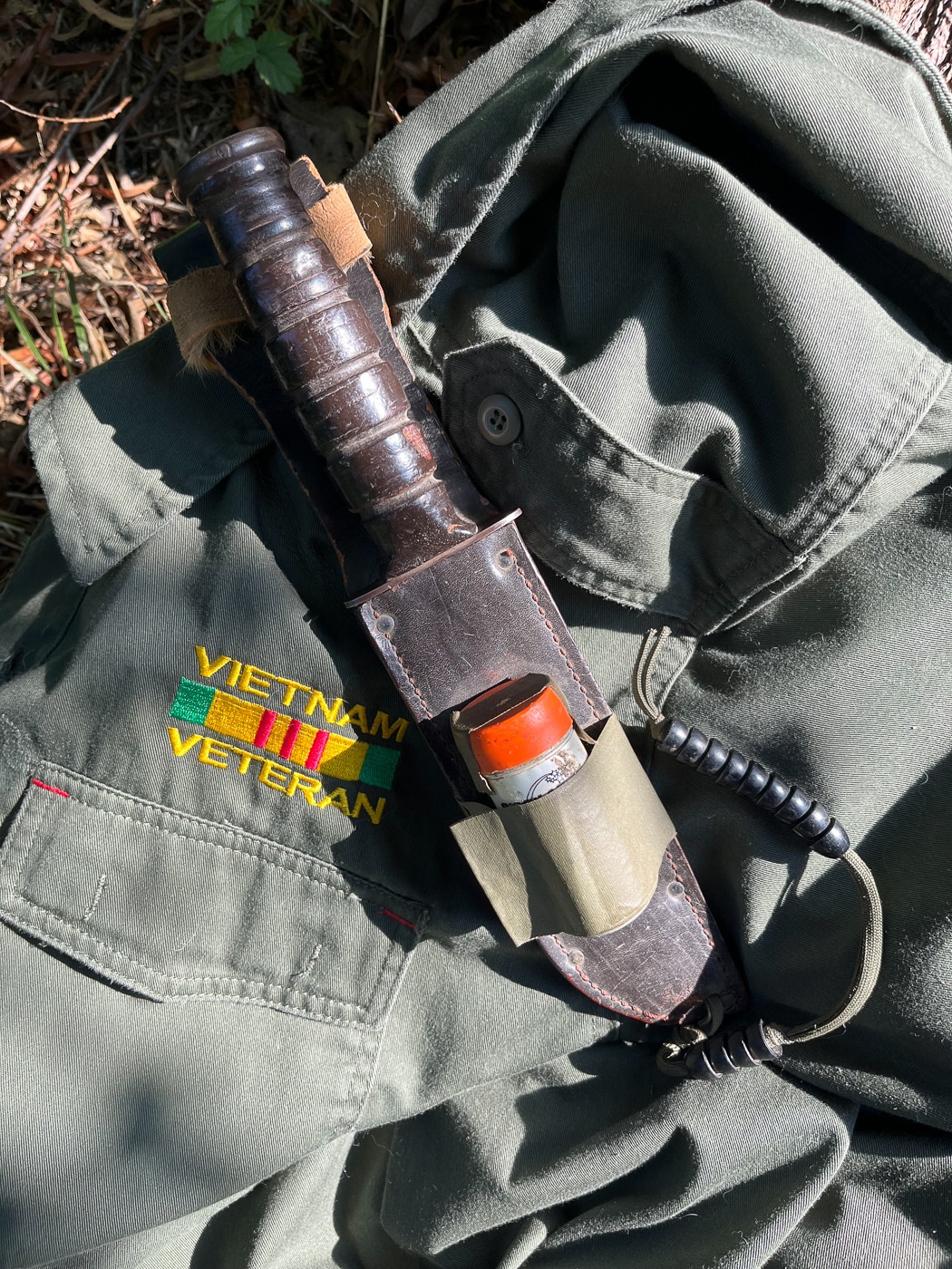 A well-worn K-Bar knife with a stacked leather handle, showing decades of use since its issue during the Vietnam War era. Fieldcraft knives build history through continuous service. Combat-issued blades prove lasting value. Dale Dye field craft knife opinions favor battle-tested designs.