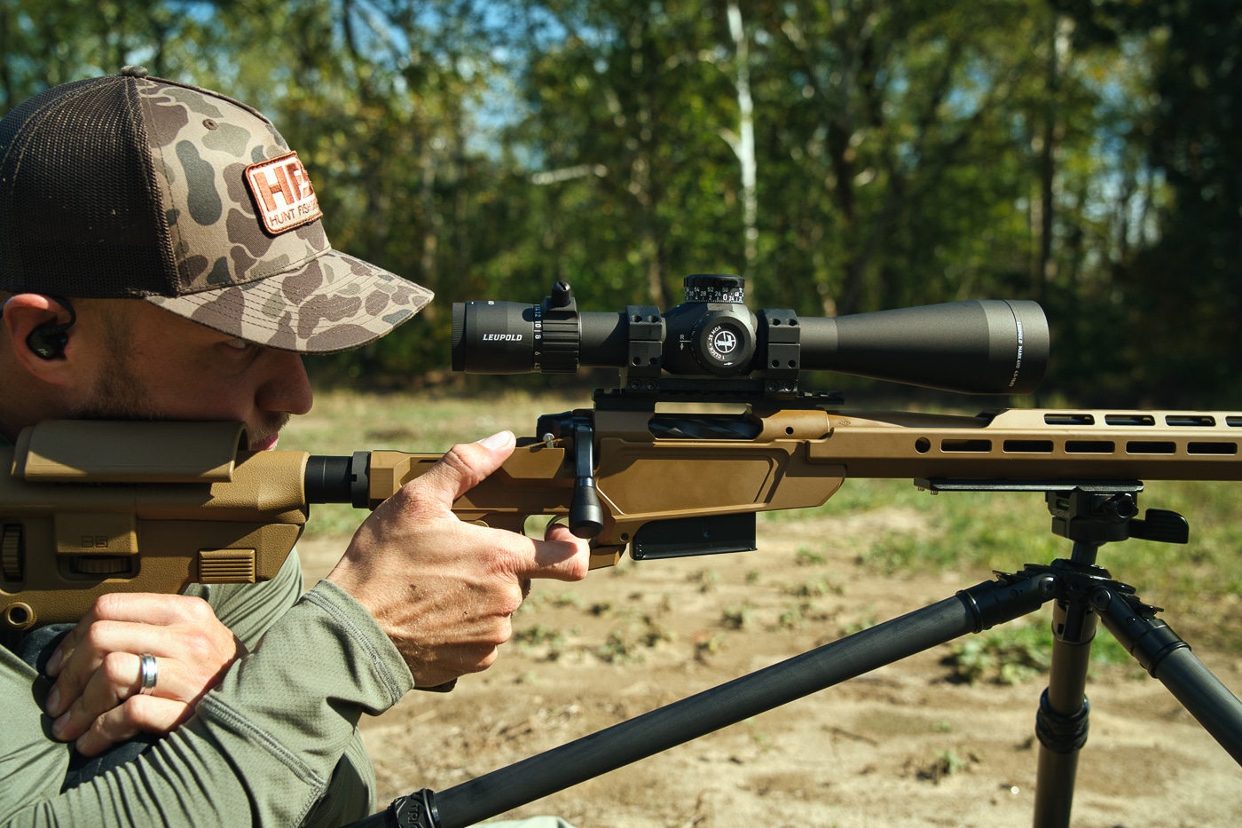 The author evaluates the Tricer-HK tripod system by shooting a scoped Springfield rifle from behind the ball head at a shooting range. Lightweight tripods must perform under live fire. The Tricer-HK tripod review demonstrates real-world durability. Carbon fiber construction withstands shooting stress effectively.