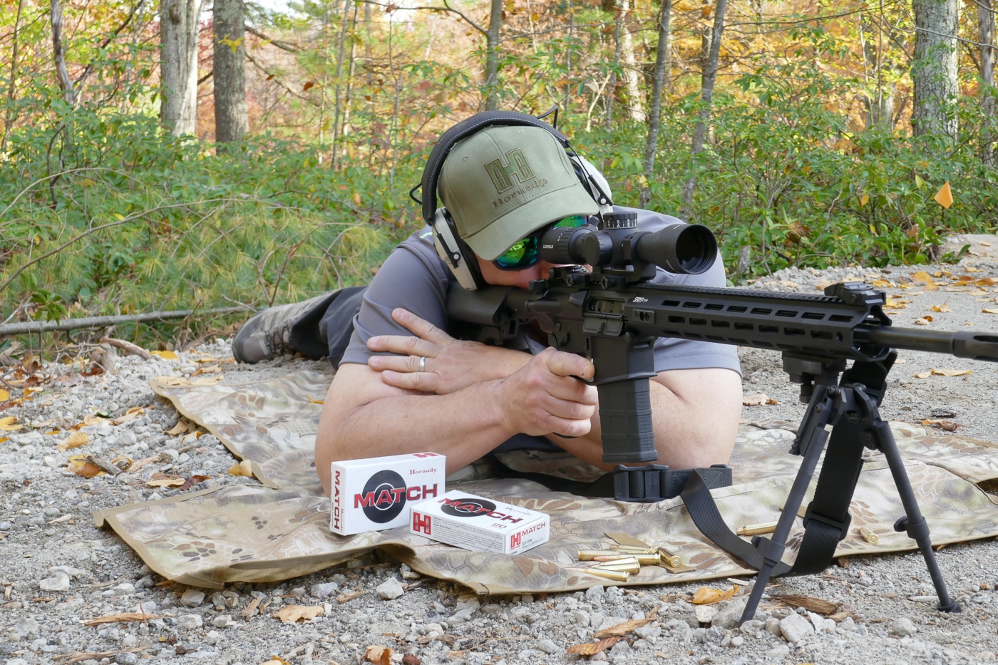 A shooter in prone position behind a Springfield Armory SAINT Victor 7.62x51mm rifle equipped with a Leupold Mark 4 HD 2.5-10x scope and GG&G XDS bipod, demonstrating proper long-range shooting form and equipment setup. The SAINT Victor 7.62 20-inch excels in precision configurations. Springfield rifles accept quality optical systems readily. Leupold optics provide reliable target magnification.