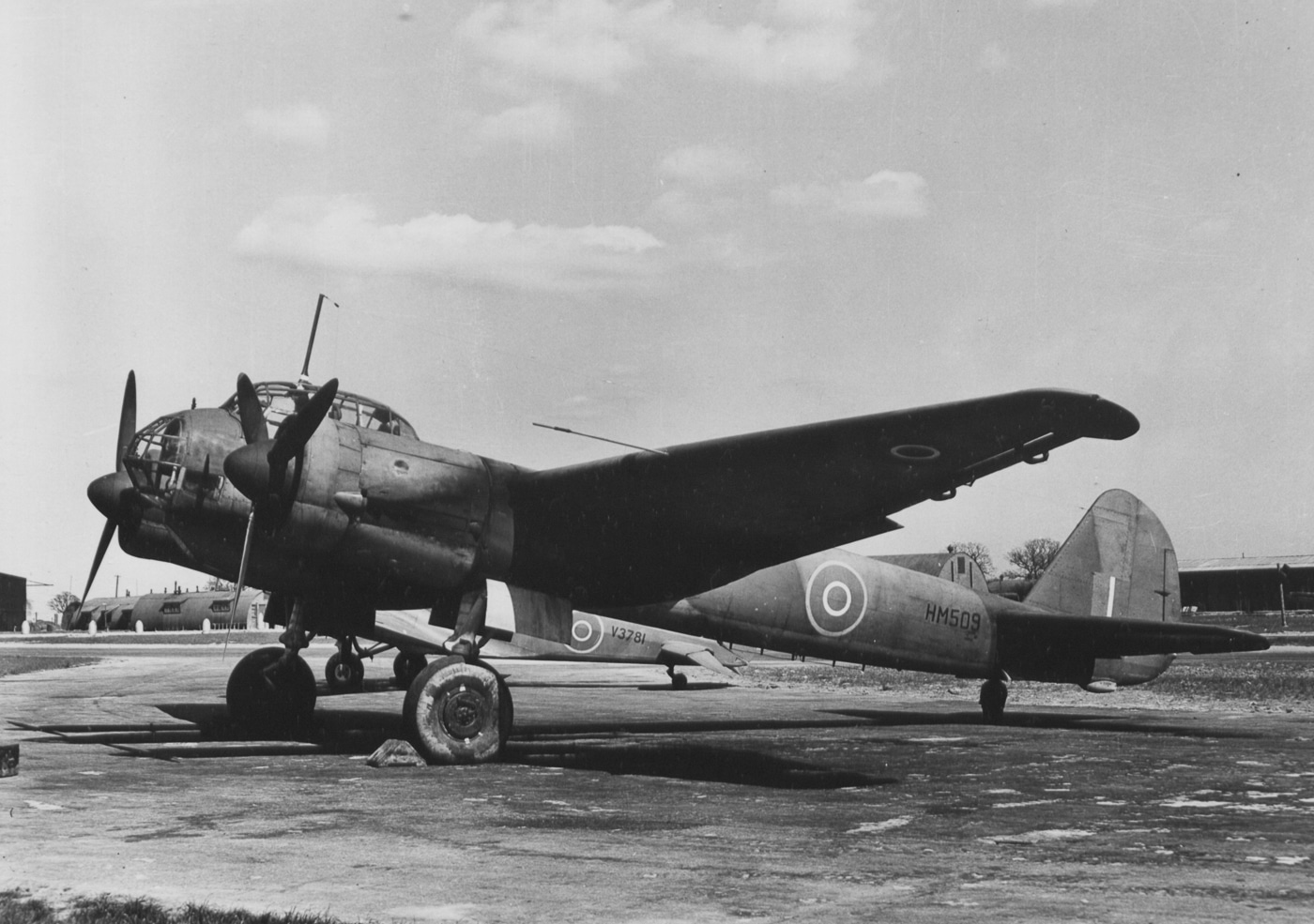 A captured Junkers Ju 88 parked at a 353rd Fighter Group airfield in England, displaying its complete airframe for Allied evaluation purposes. The Ju 88 bomber provided valuable intelligence when captured. Allied forces tested enemy aircraft extensively. Fighter groups studied German bomber characteristics. Intelligence operations analyzed Luftwaffe equipment. Captured aircraft revealed construction techniques. Enemy technology assessment improved combat effectiveness. RAF squadrons operated specialized evaluation units. American bases hosted captured German planes.