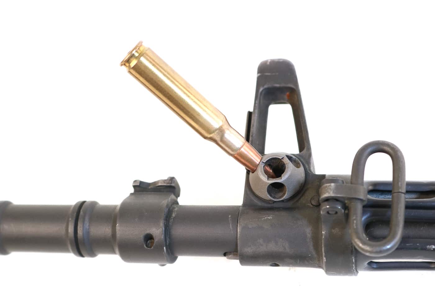 A close-up photograph of the gas system adjustment mechanism on a Dutch AR-10 rifle, showing the selector that allows disabling gas flow for rifle grenade launching capabilities. The AR-10 featured tactical versatility. Gas systems enabled grenade launching. Stoner designed multifunctional weapons. AR10 history includes military innovation. The rifle accommodated multiple roles. Dutch models retained this feature. Infantry needed grenade capability. Combat requirements drove design.