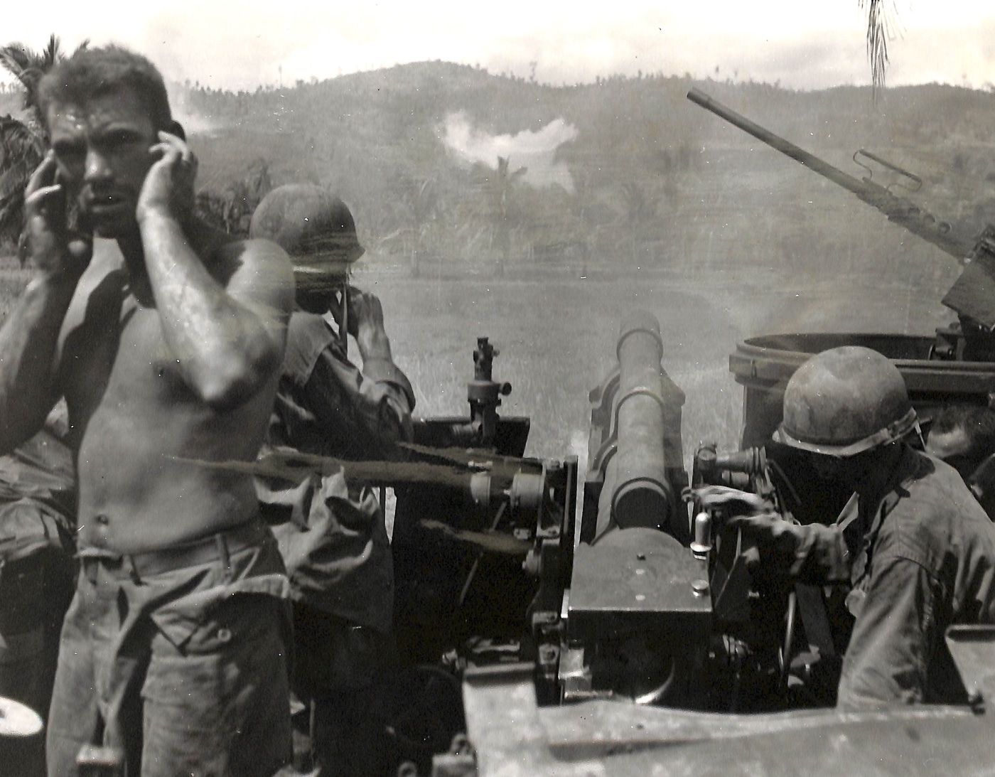 American self-propelled artillery supports infantry on Leyte Island during WWII