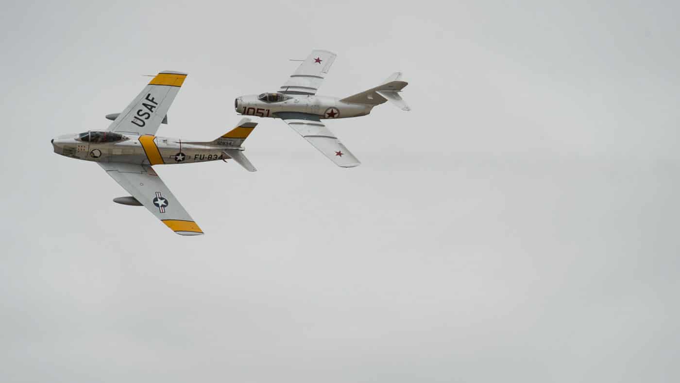 F-86 Sabre and a MiG-15 aircraft simulate a dogfight