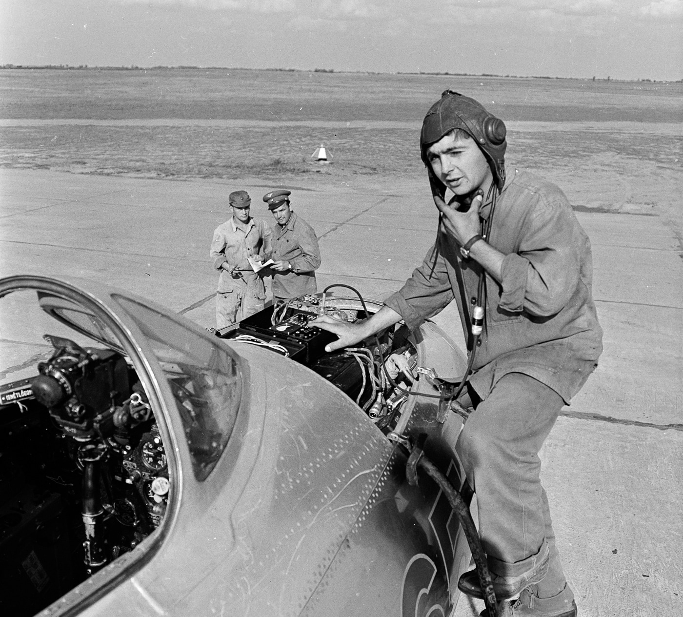 Hungarian Air Force crewman works on a MiG-15 engine at Szolnok Hungarian Air Base 1964