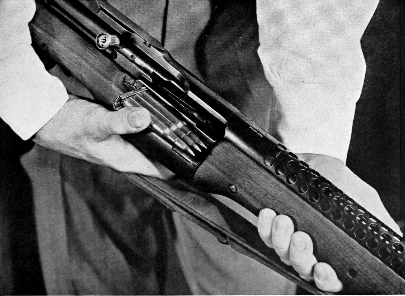 M1941 Johnson rifle loading with Springfield 5-round bolt open