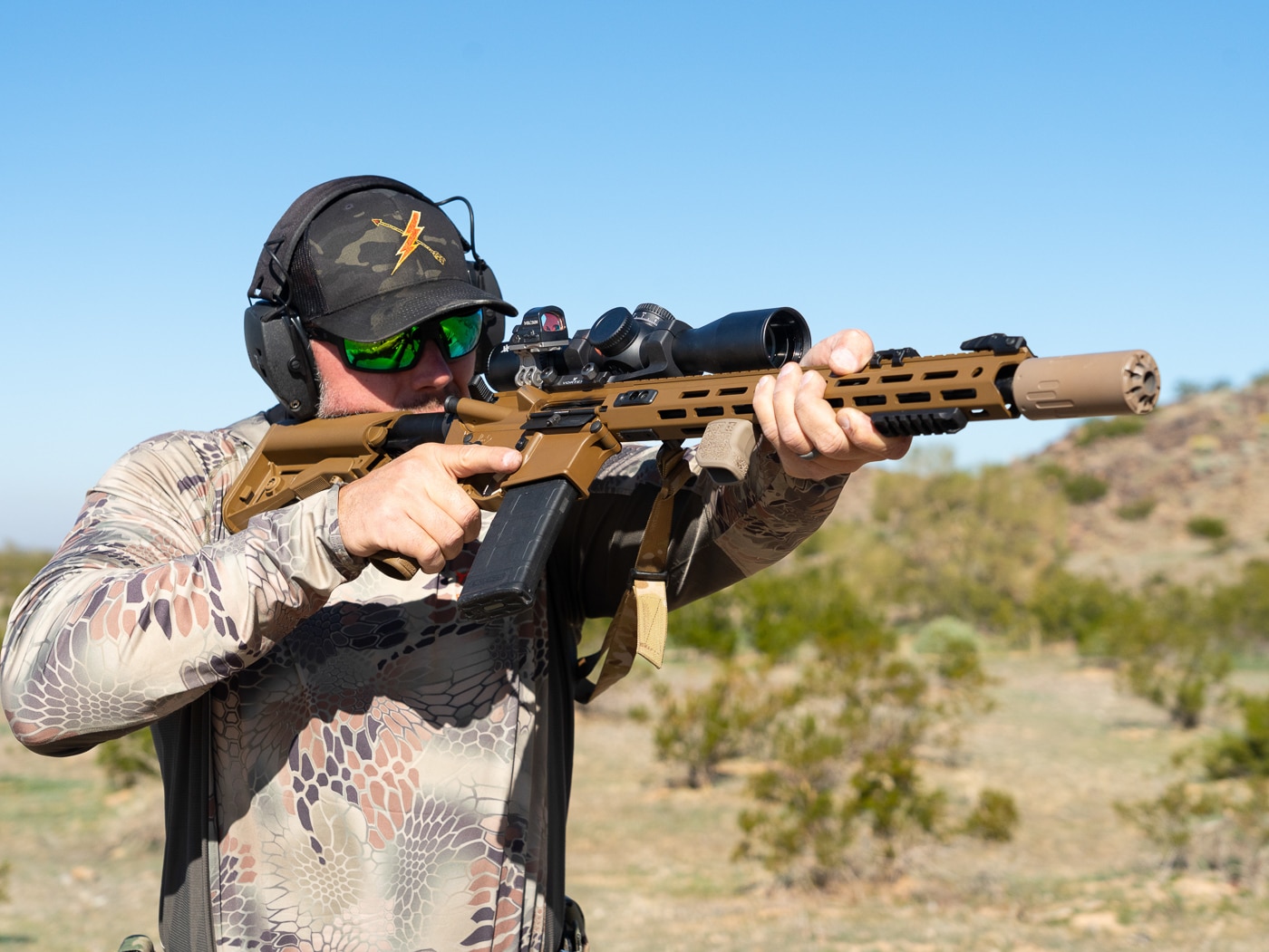 author shooting SAINT in CQB with suppressor