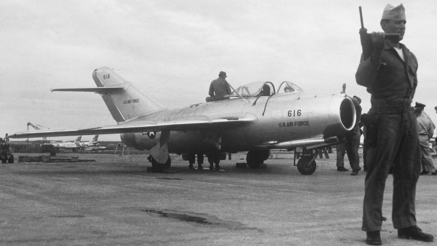 captured MiG-15 under guard by USAF police armed with M3A1 Grease Guns