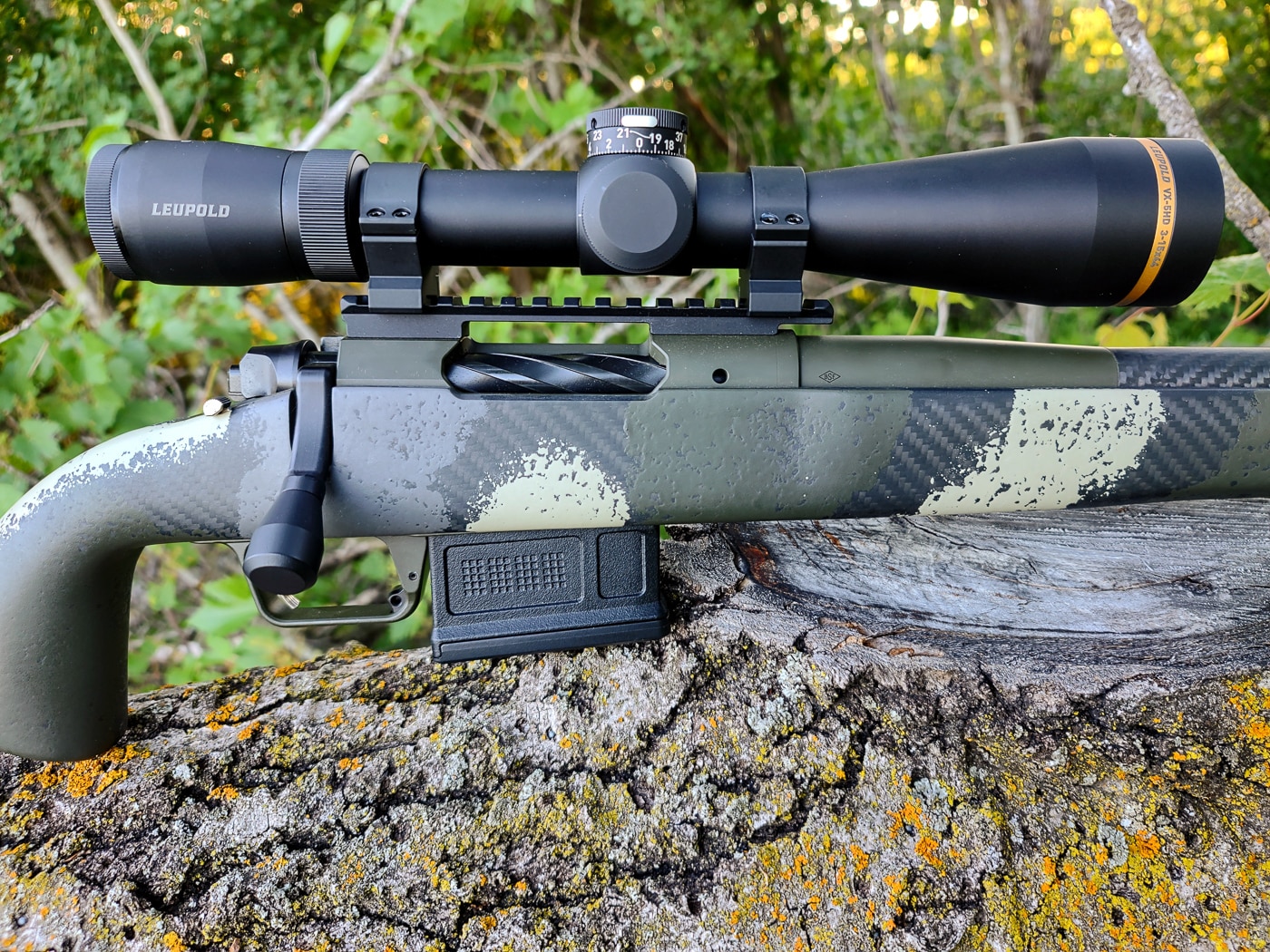 A close-up photograph shows the bolt handle and receiver of a Springfield Waypoint rifle, highlighting the bolt-action mechanism preferred by discerning hunters. First hunting rifles commonly feature bolt-action designs. Beginner's hunting rifles benefit from simple manual operations. Bolt-action mechanisms deliver superior accuracy. Controlled-round feeding ensures reliability. Modern receivers accommodate various cartridge lengths. Short-action versus long-action affects rifle dimensions. Mechanical simplicity reduces potential malfunctions. Proven designs inspire shooter confidence.
