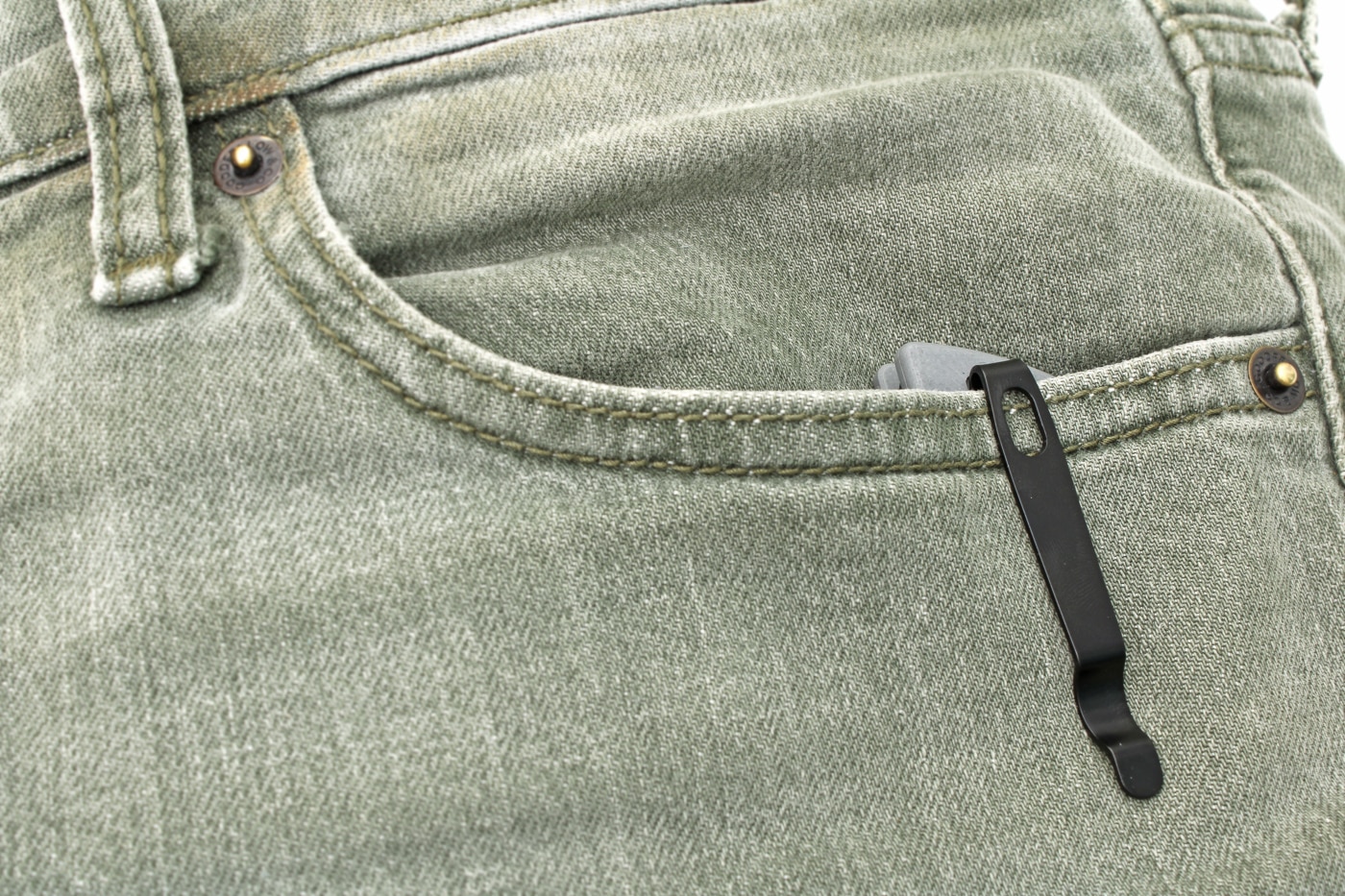 pocket clip visible outside of pocket when being carried