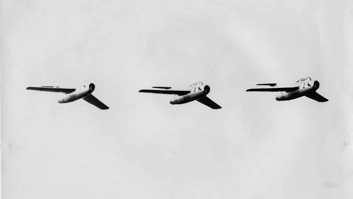 three MiG-15UTI fighters flying in formation at Rissala Air Show in 1963