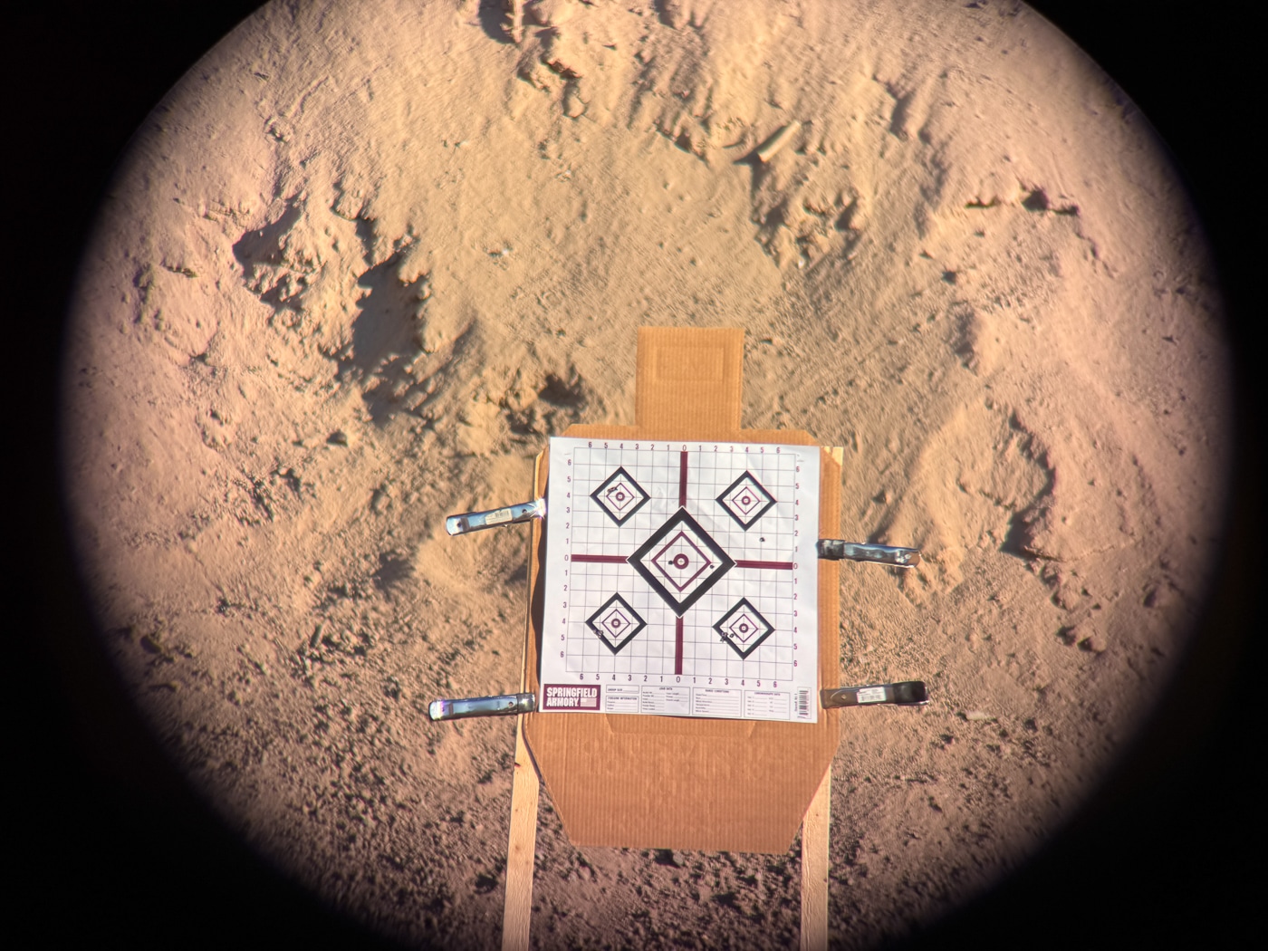 using the Ollin system with a spotting scope to show a distant paper target