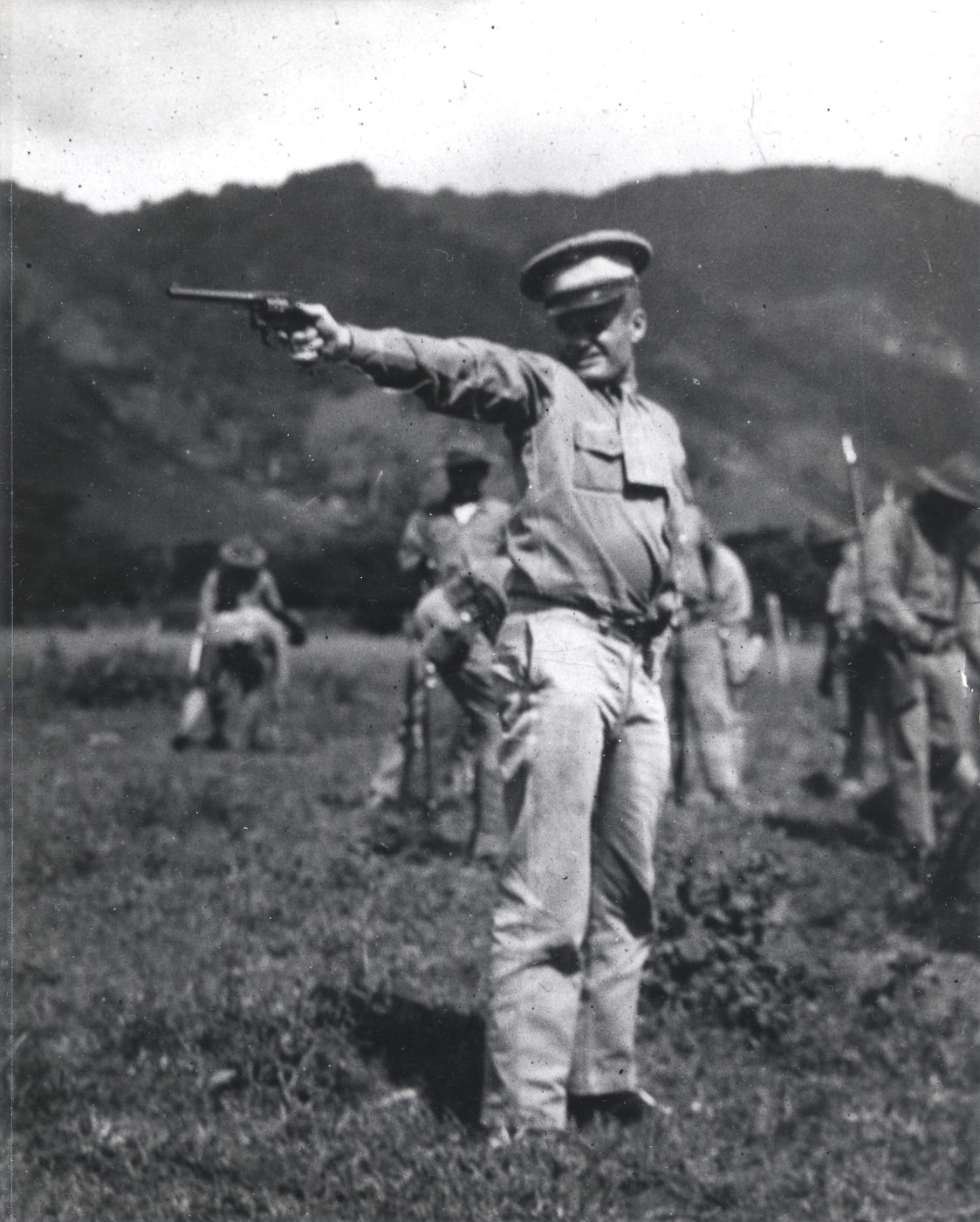 Chesty Puller fires a revolver during 1931