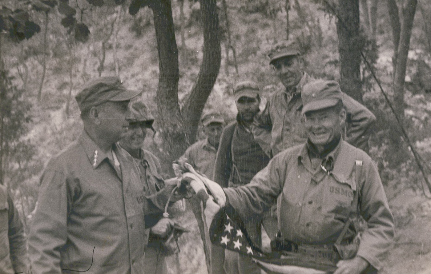 Chesty Puller with 1st American flag flown over Seoul Korea 1950