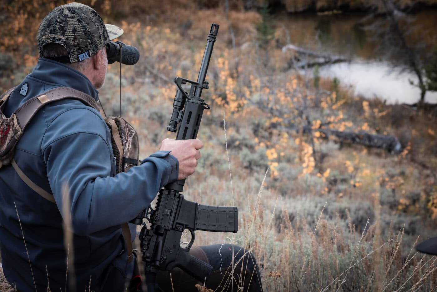 A Springfield SAINT AR-15 rifle is shown in a hunting context as a versatile option for new shooters taking to the field. The best AR-15 for beginners should perform reliably across multiple uses including hunting and home defense. Entry-level AR-15 rifles chambered in .223 Remington are well-suited for varmint and predator hunting. New hunters benefit from the AR-15's low recoil and easy follow-up shot capability. The Springfield SAINT's modular design allows hunters to configure the rifle for specific game and terrain. Beginner-friendly hunting rifles should be lightweight, accurate, and simple to maintain in the field. The AR-15 platform gives first-time hunters access to a wide range of compatible optics and accessories. Starter AR-15 models like the SAINT offer the reliability needed for hunting in varied outdoor conditions. The Springfield SAINT is a strong choice for beginners who want one rifle that hunts, defends, and competes.