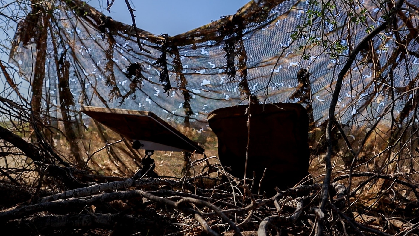 Starlink Mini concealed with camo netting