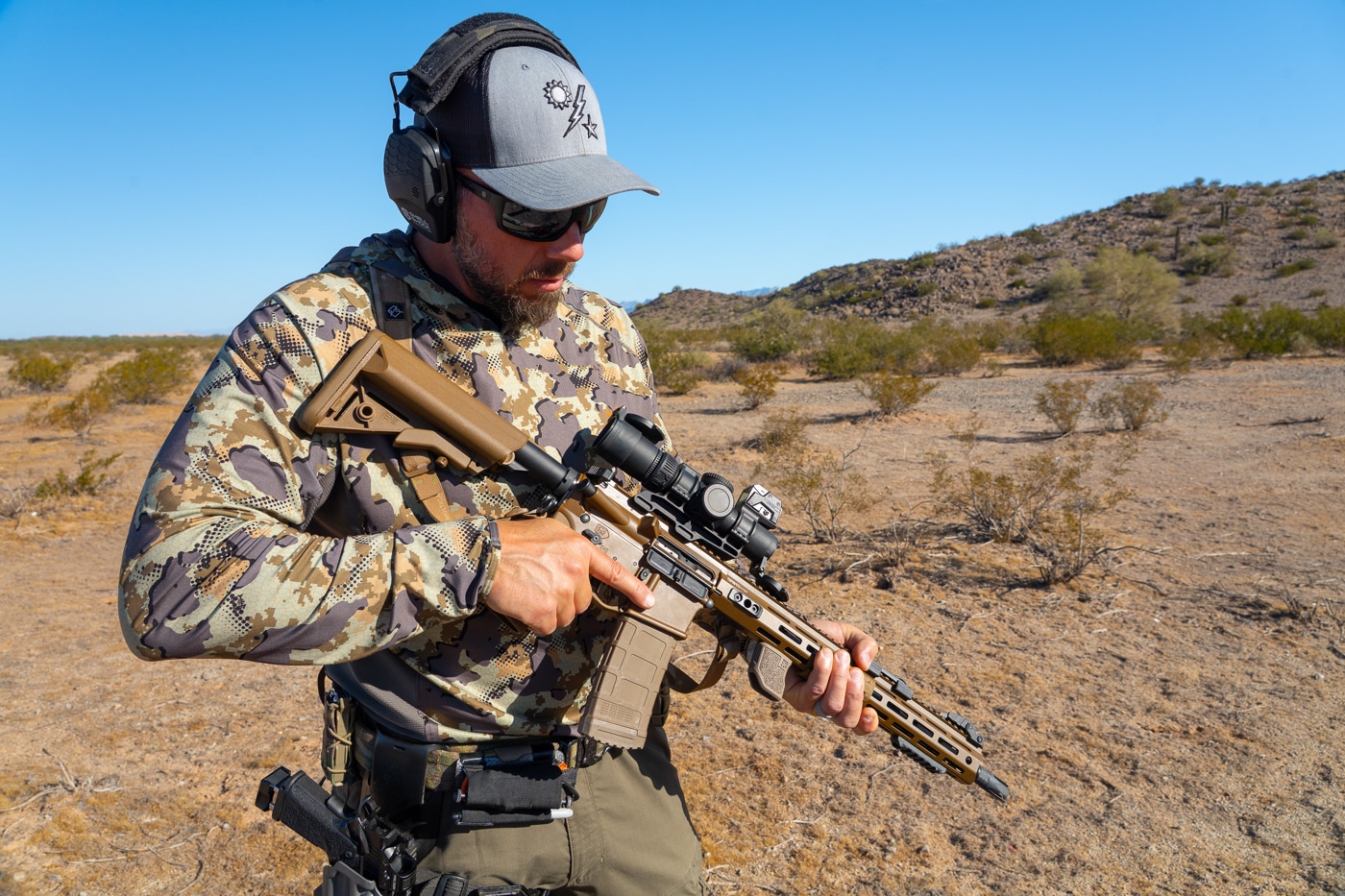 author carrying Springfield SAINT rifle during range testing of Vortex AMG 1-10x scope
