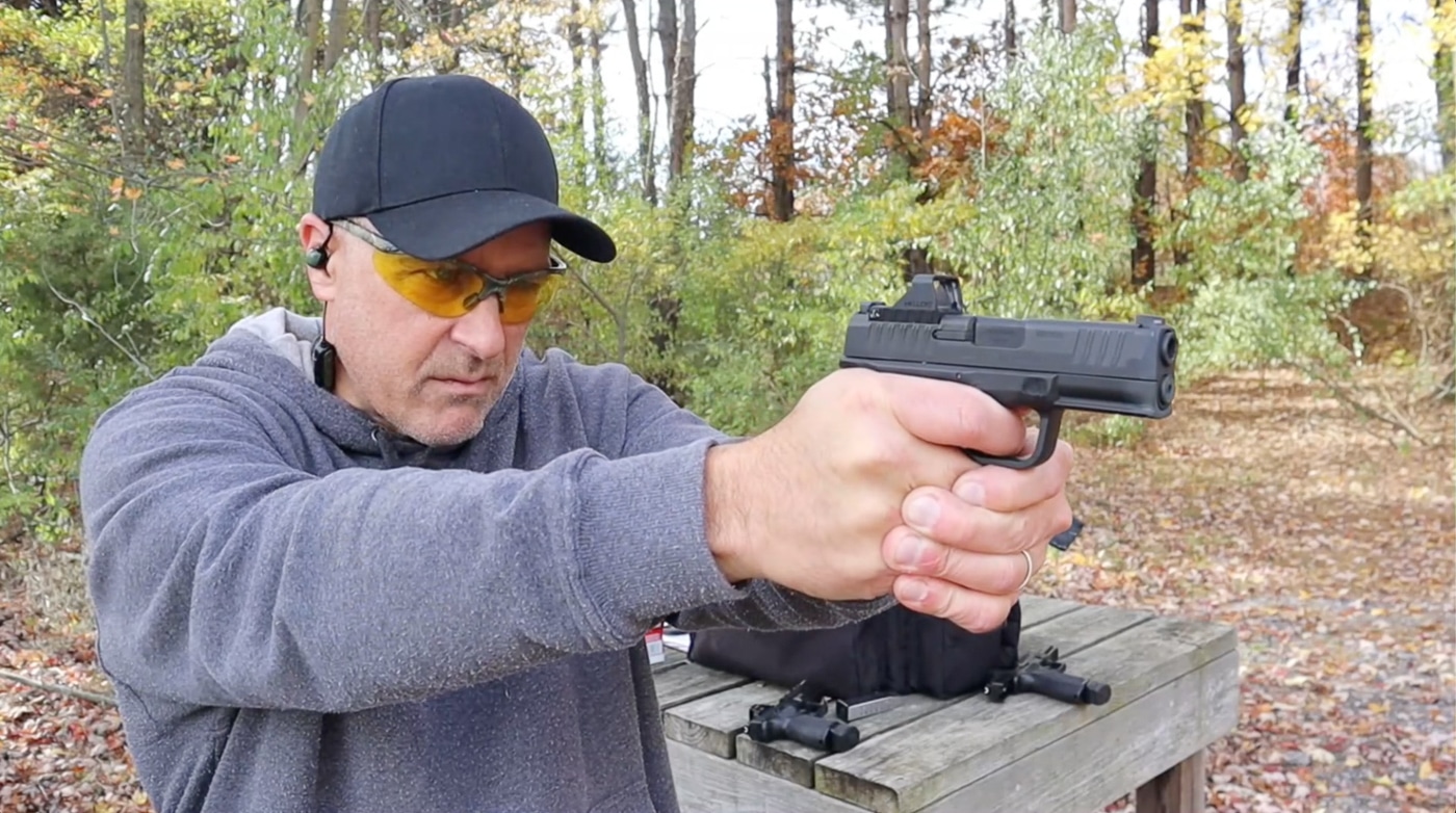 author shooting Viridian RFX11 on the pistol range