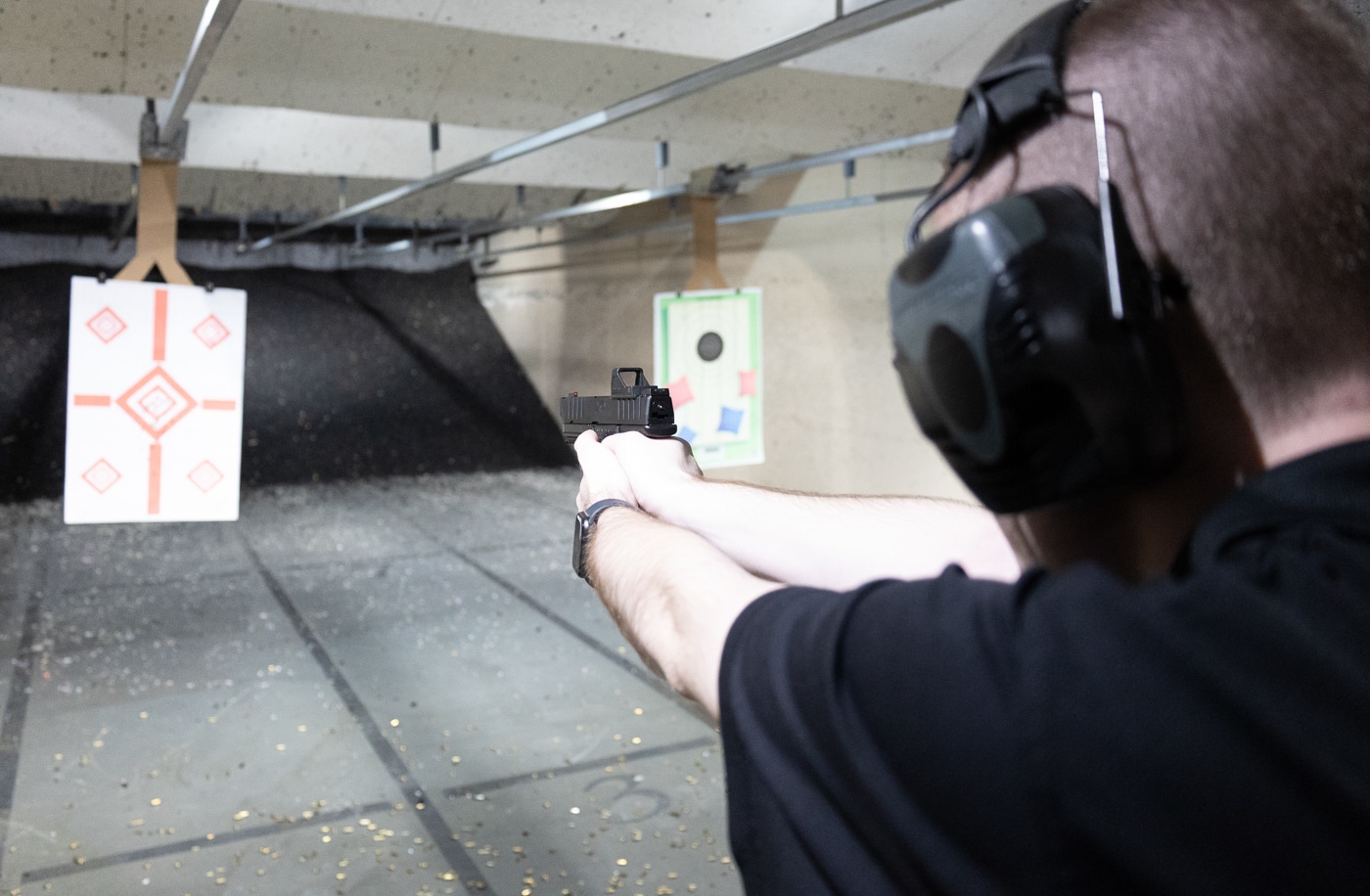 author shooting the Springfield XD Mod.4 on an indoor range