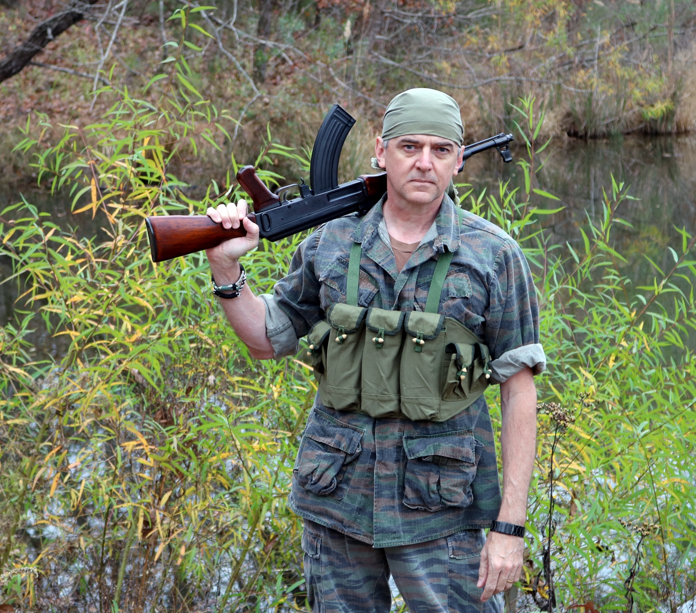 author with AK-47 in Vietnam