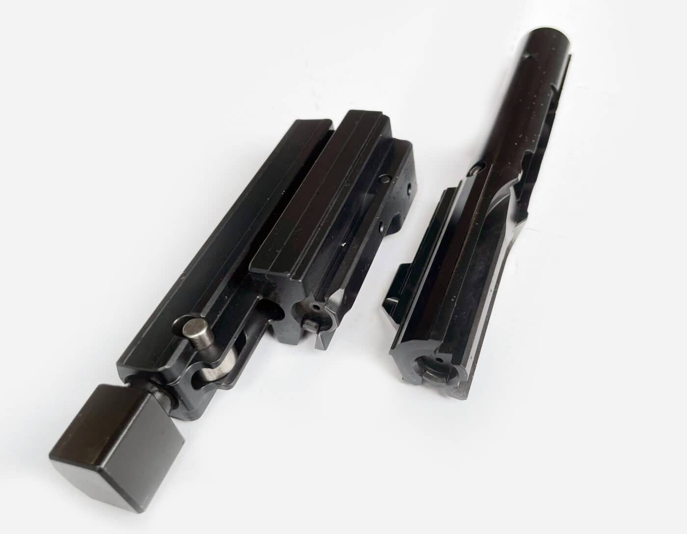 roller delayed action on left straight blowback on right