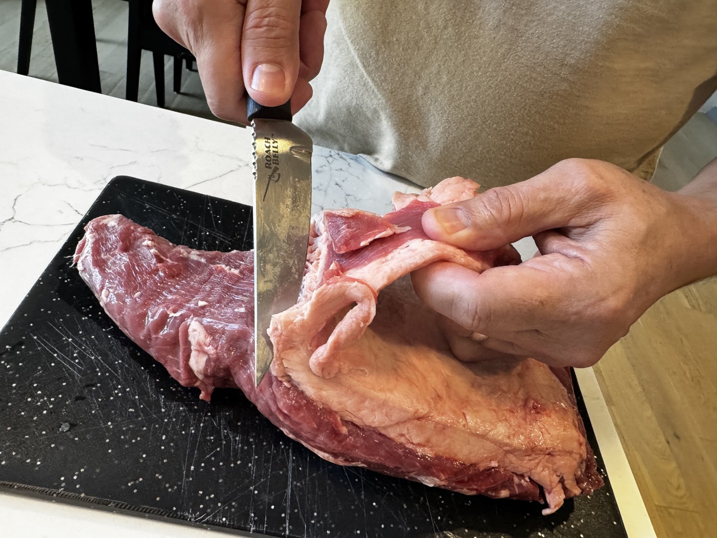 using the Cold Steel Roach Belly to trim a steak before grilling