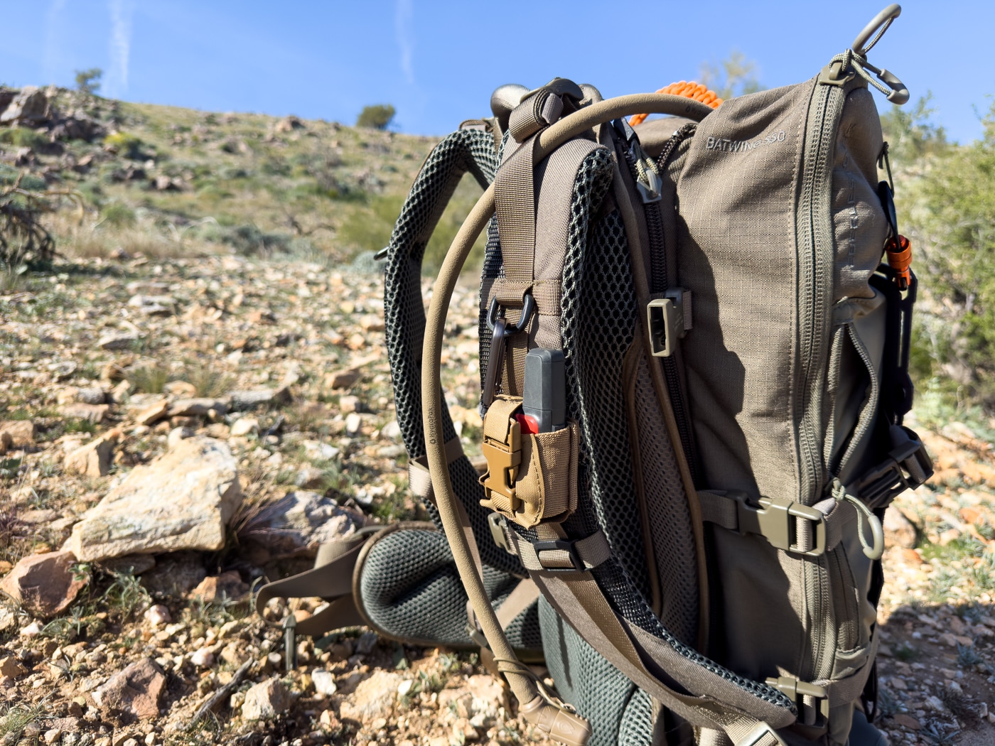 Garmin inReach Mini 2 attached to a backpack for a hike