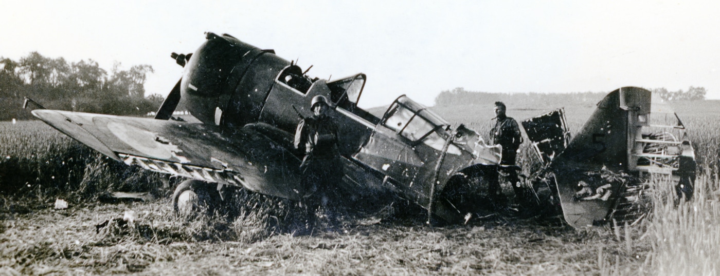 German troops review a wrecked French Hawk 75A-2