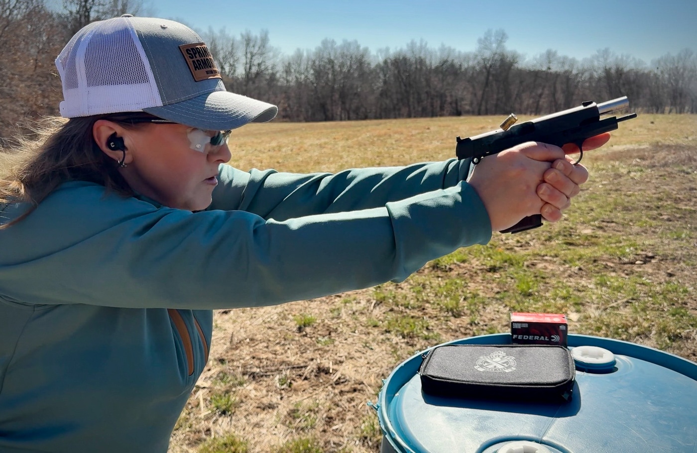 Julie Golob demonstrates modest recoil of SA-35 compact