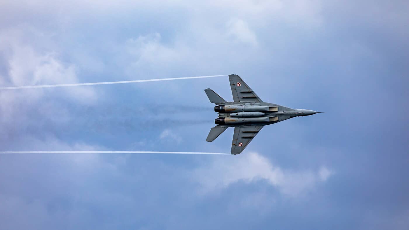 Polish MiG-29 flies over Arleigh Burke class destroyer USS Porter DDG-78