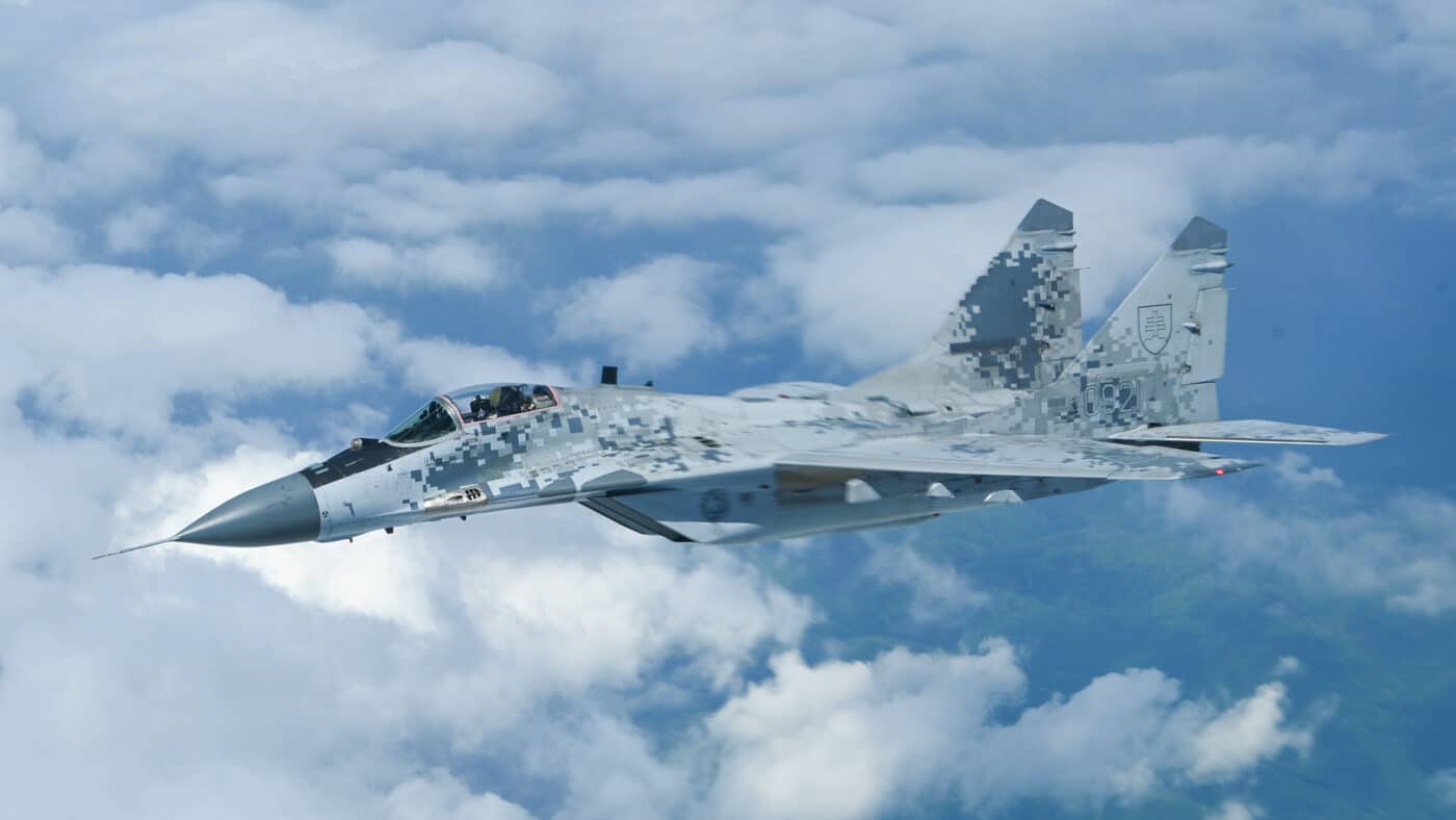 Slovakian Air Force MiG-29 flies alongside a B-52H Stratofortress