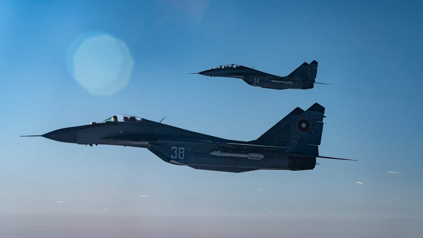 Two Bulgarian MiG-29 Fulcrums conduct a simulated intercept with a U.S. Air Force B-52H Stratofortress during exercise Onyx Cross