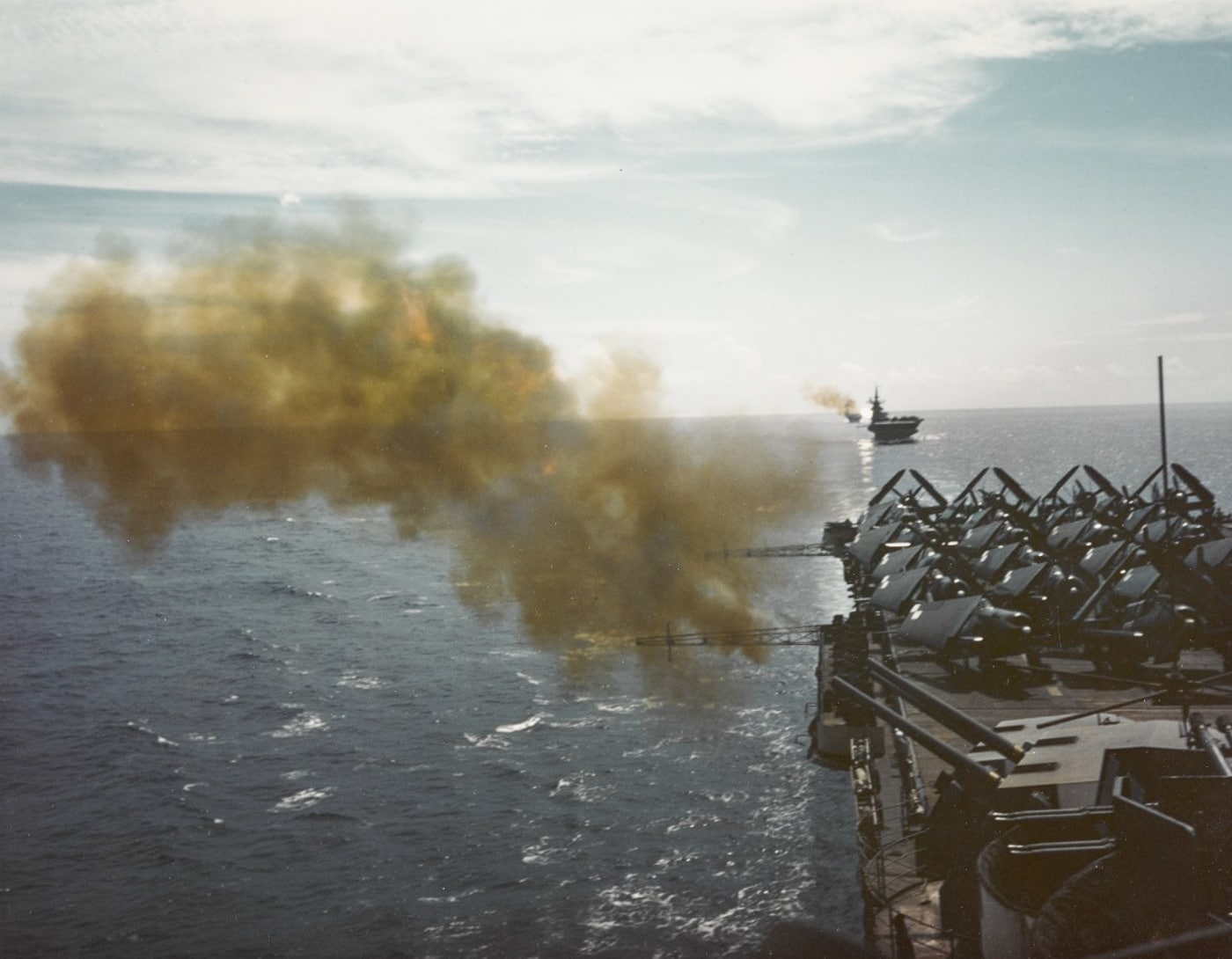 USS Hornet fires 5-inch guns during practice in Western Pacific Ocean June 1945