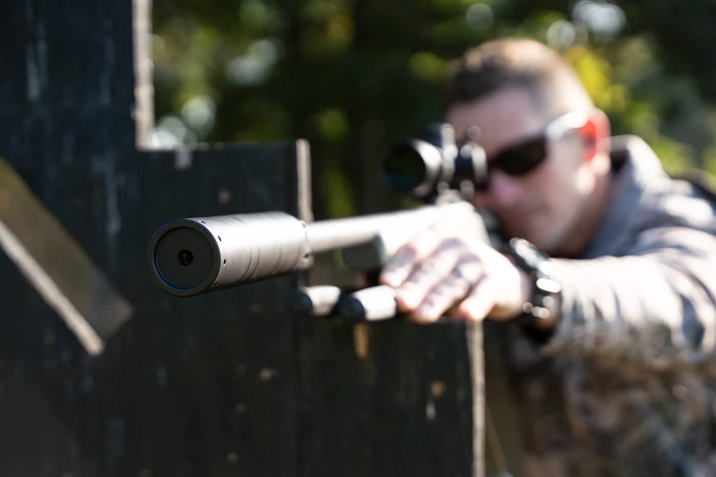author shooting rifle to prepare for a safe hunt